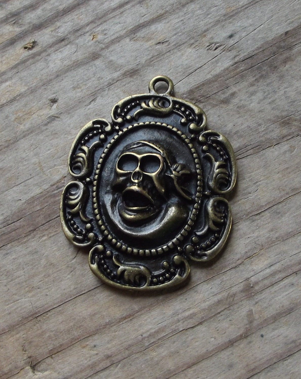 Large gold tone Pirate Skull Medallion charm / Jewelry