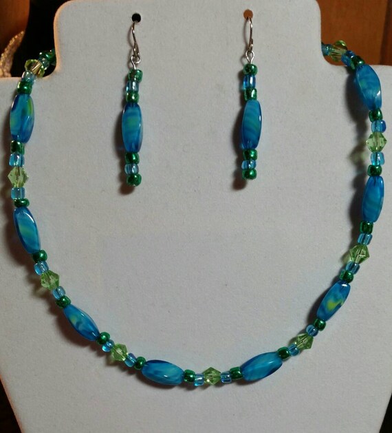 Items similar to Teal necklace and earring set on Etsy