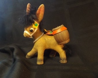 Kitschy 50's burro with barrels.