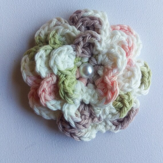 Pink, Green, Beige, and White Crochet Flower