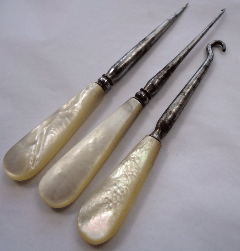 Three vintage/antique MoP handled needlework tools crochet