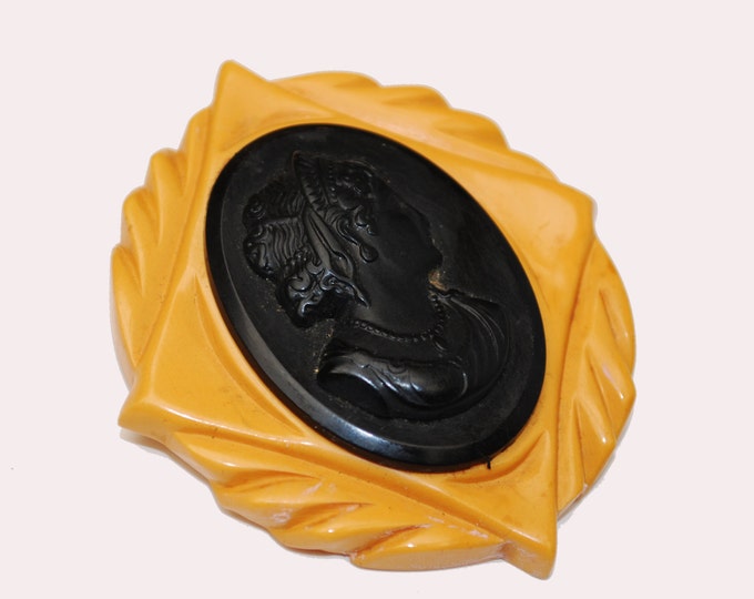 Large Bakelite Cameo brooch with black and butterscotch carved vintage plastic pin