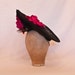 Stunning black occasion hat with fushia pink rose detailing handmade in Yorkshire by Jacqueline Walker Millinery Stunning black occasion hat with fushia pink rose detailing