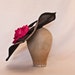 Stunning handmade gunmetal coloured contrast hat decorated with a large hot pink rose