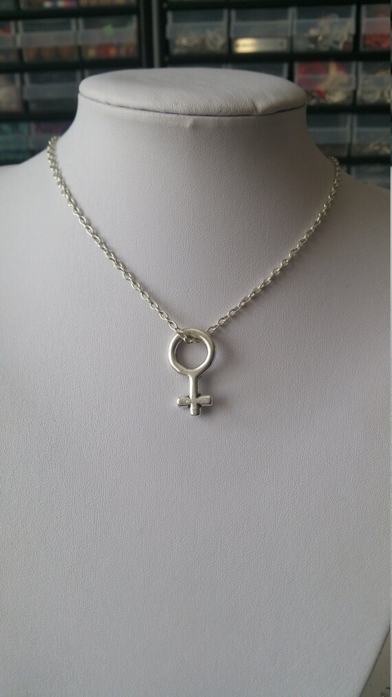 Silver Female Sex Symbol Necklace on Silver Crossed Chain