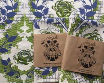 Screen-printed tea towel featuring Rose design in green and blue.
