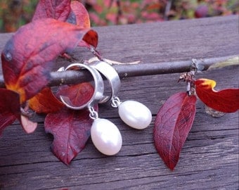 Silver earrings with freshwater pearls.