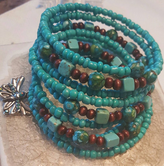 Turquoise glass and stone beads on memory wire with butterfly
