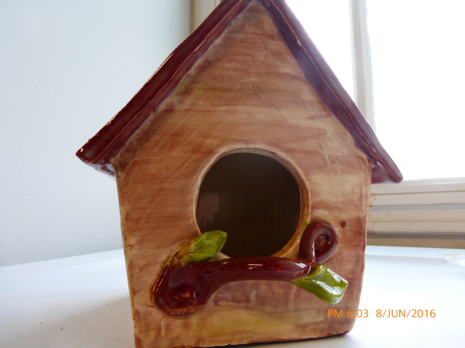 Handmade clay birdhouse