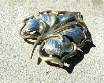 Gold and silver leaf brooch