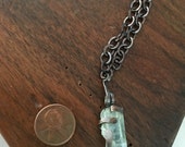 Aquamarine beryl in hammer forged Copper basket claw on 17 inch Copper and Steel chain