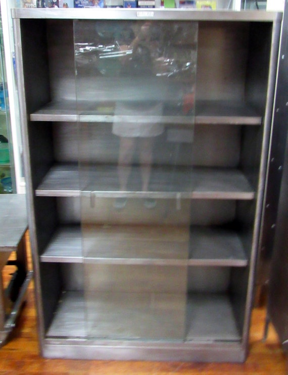Industrial Bookcase glass sliding doors by McDowell & Craig Mid Century Modern