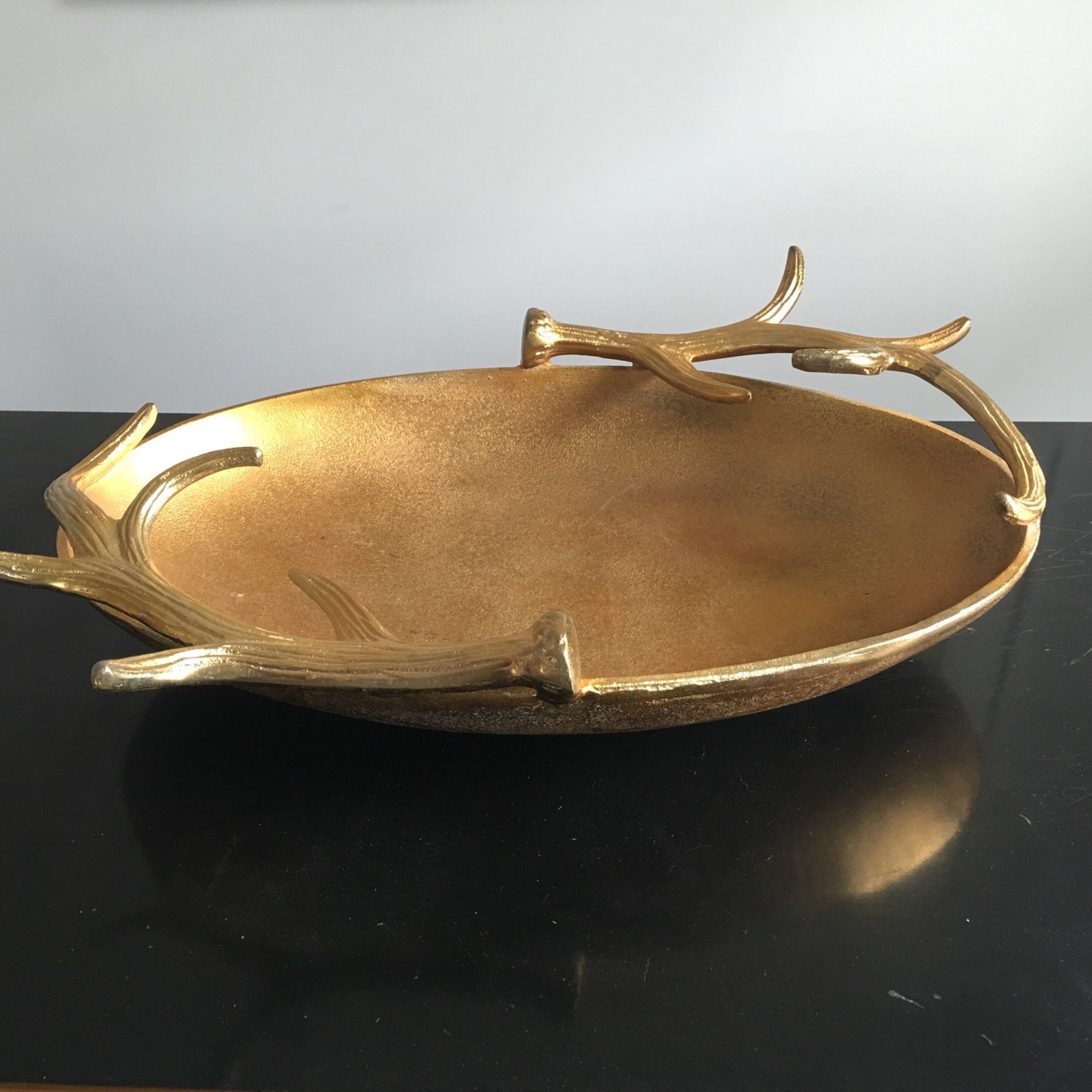 Gold decorative bowl accented with antlers Rustic Glam.