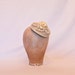 Handmade champagne coloured cord fascinator hat, decorated with handmade ribbon roses