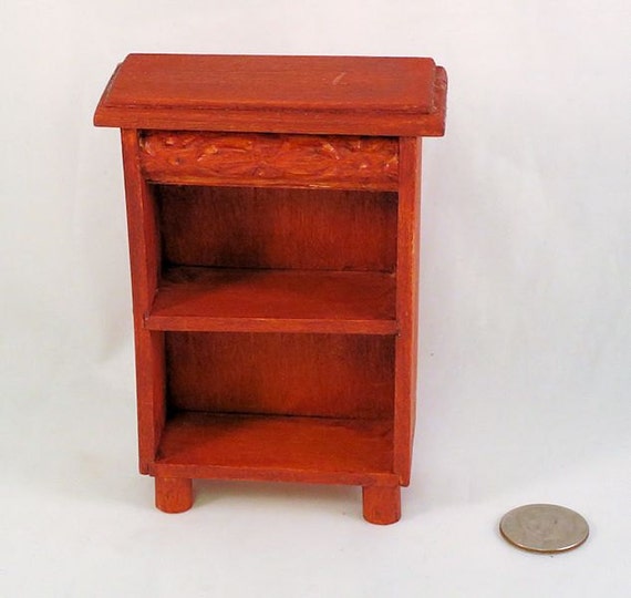 SALE priced. Faux mahogany bookcase with 2 shelves carved