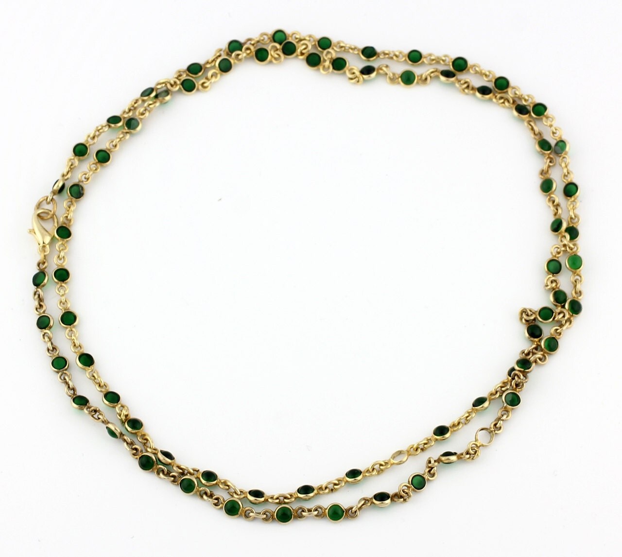 Swinging Gold Tone Chain & Green Gems Necklace gold tone