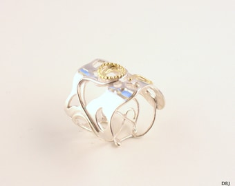 Silver ring with gold details