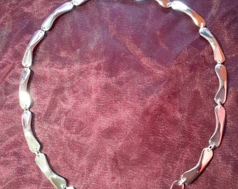 Hand forged sterling silver Bomerang link necklace