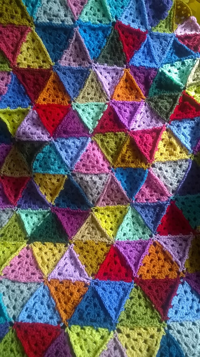 Crocheted granny triangle blanket