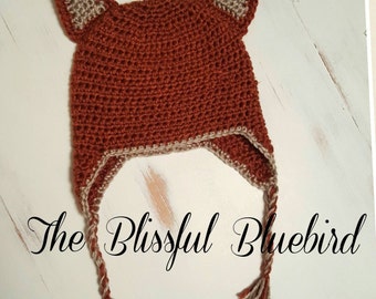 Fox stocking cap with ear flaps; burnt orange hat