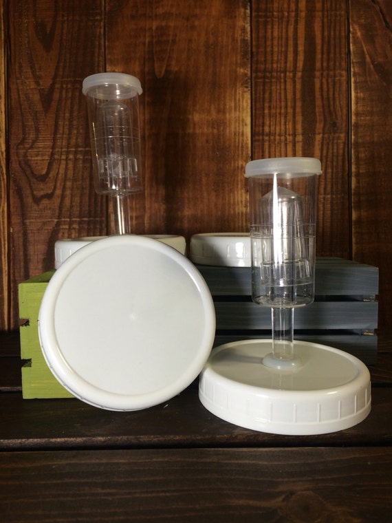 Two airlock fermentation lids with leak proof storage lid for