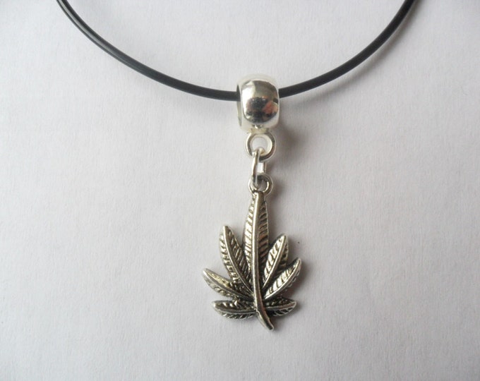 Weed pendant charm cord necklace that is adjustable from 18" to 20"