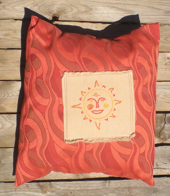 Hand embroidered red orange and gold sun pillow by elainenthesun