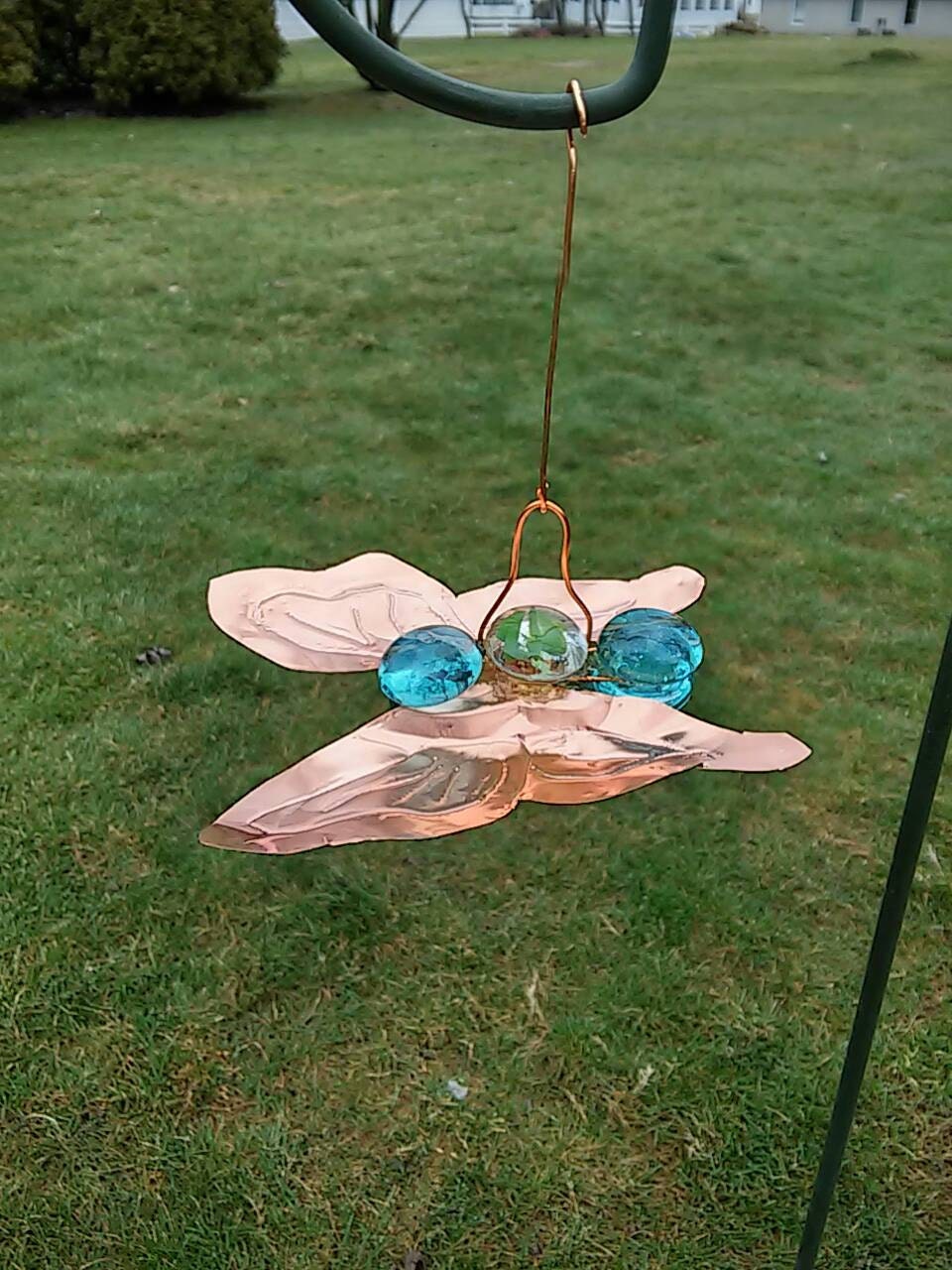 Butterfly garden ornament of copper and glass adds interest to your