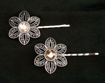 Set Of 2 Silver Metal Flower Hair Pins With Pink/Peach Colored Stones