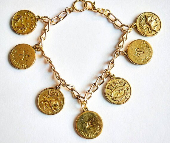 Items similar to Gold Zodiac Charm Bracelet on Etsy