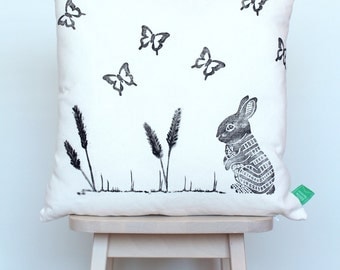 Cushion cover with rabbit and butterflies, hand-stamped