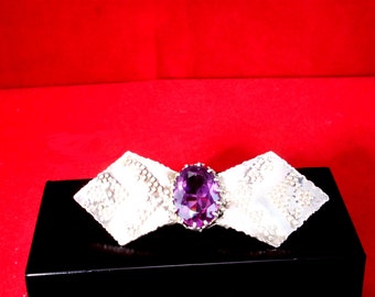 Silver brooch with amethyst