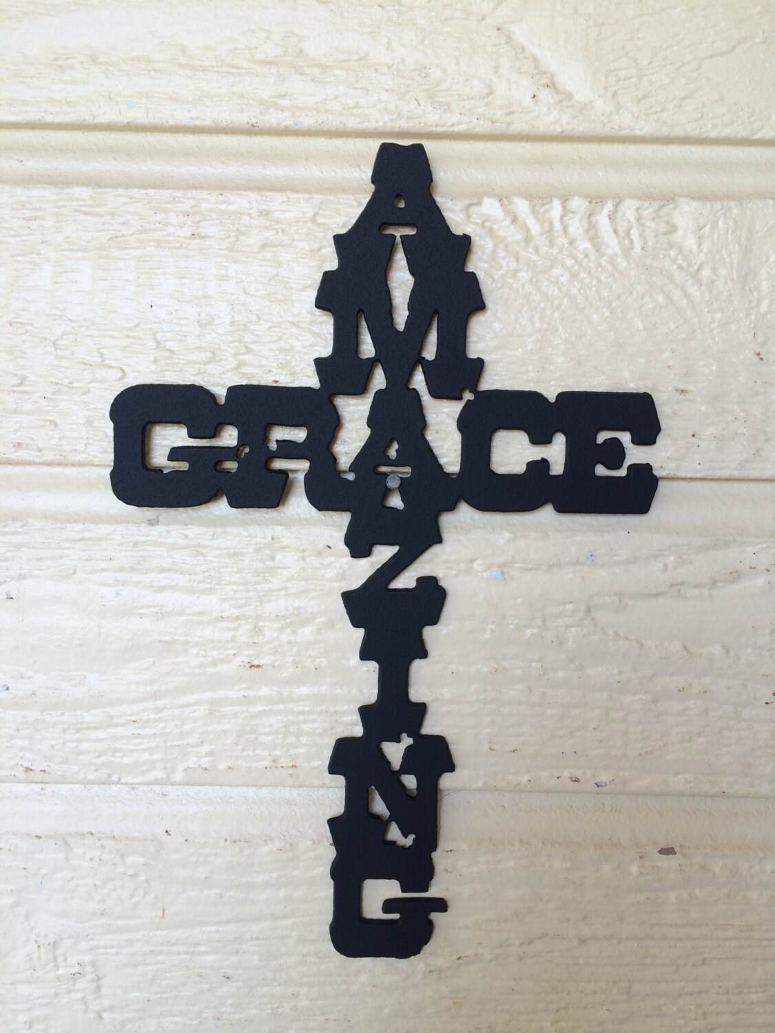 Metal cross amazing grace