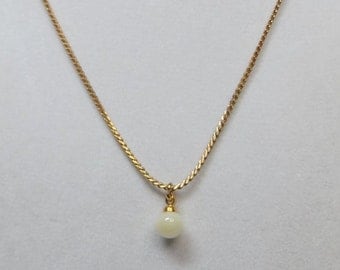 Creamy Mother of Pearl on Gold tone chain
