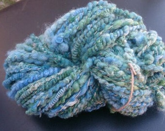 Designer art yarn soft alpaca and wool, handspun and hand-dyed. Shades of blue and dark marine green. 165 grams. Weaving, crochet, knitting