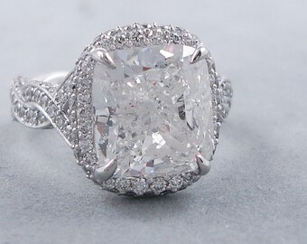 Glamorous 6.73 ctw Cushion cut diamond ring with a 5.50 ct F/SI3 Clarity Enhanced Cushion cut diamond