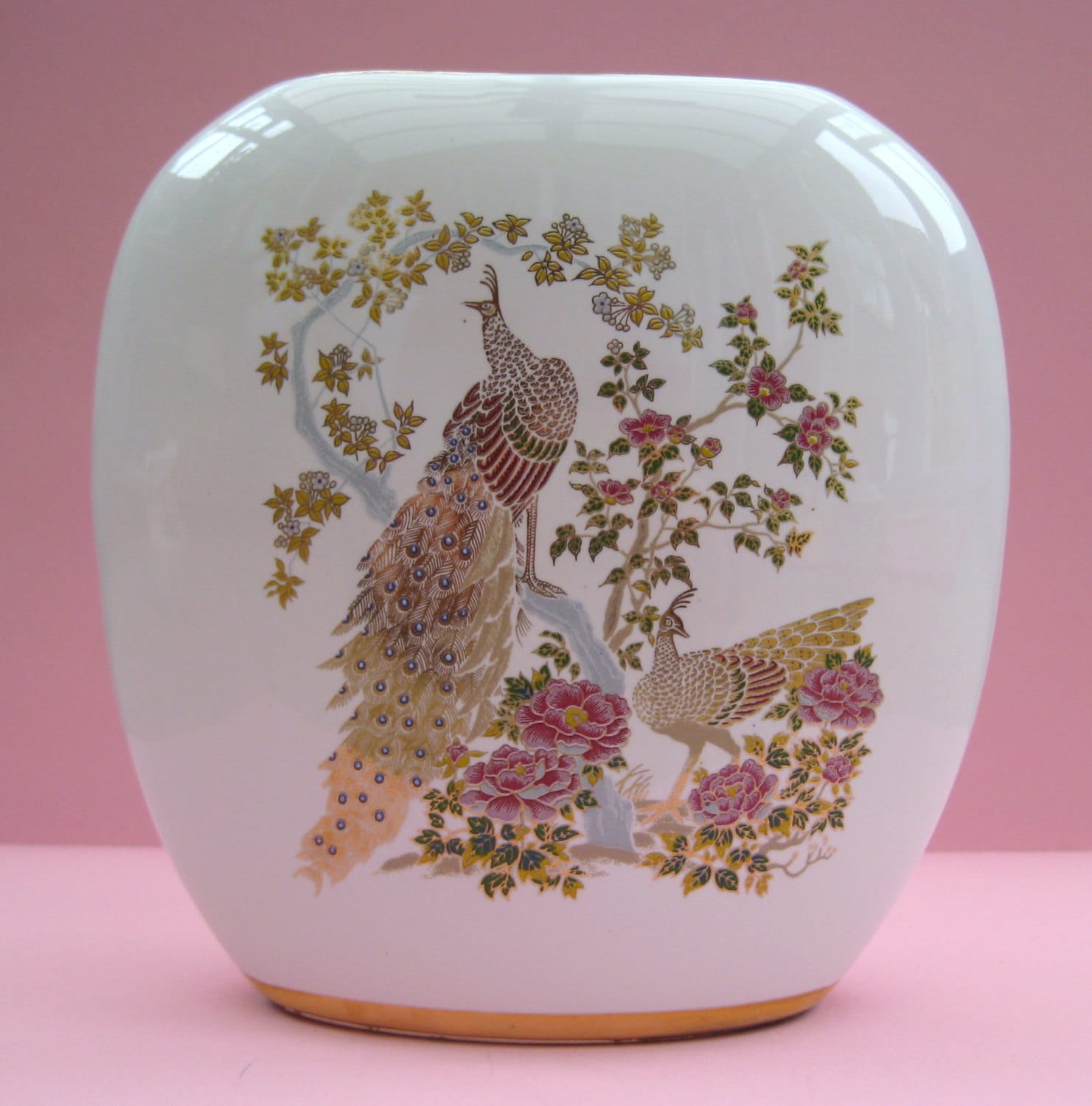 Vintage white porcelain vase with golden peacock pattern