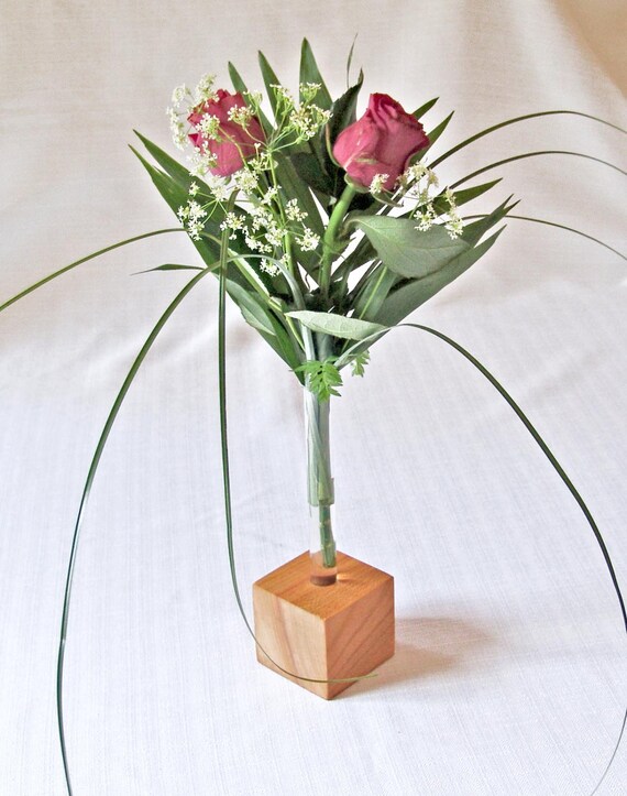 Flower vase made of cherry wood with 1 or up to nine glass
