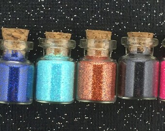 Tiny little glass jar of glitter!