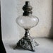 French Oil Lamp with Glass Globe and Cast Metal Base
