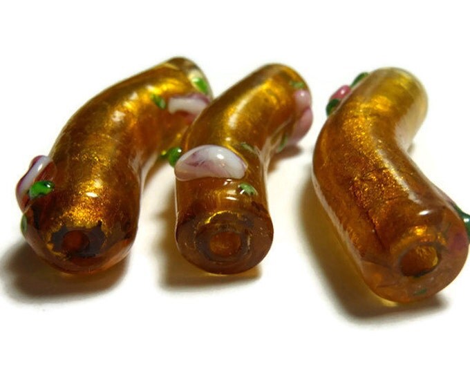 Bead, lampwork glass curved noodle tube bead, amber yellow and pink flowered glass over silver foil, 36x10mm - pkg of 3