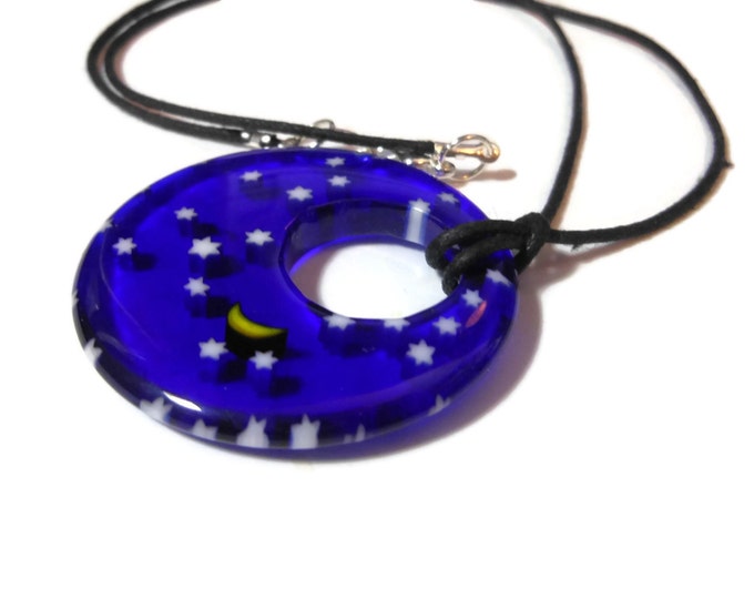 Millefiori glass pendant, 40mm round dark blue with field of stars and a yellow half moon, round go-go on black cord, silver plated findings