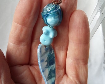 Glass and porcelain mermaid necklace.