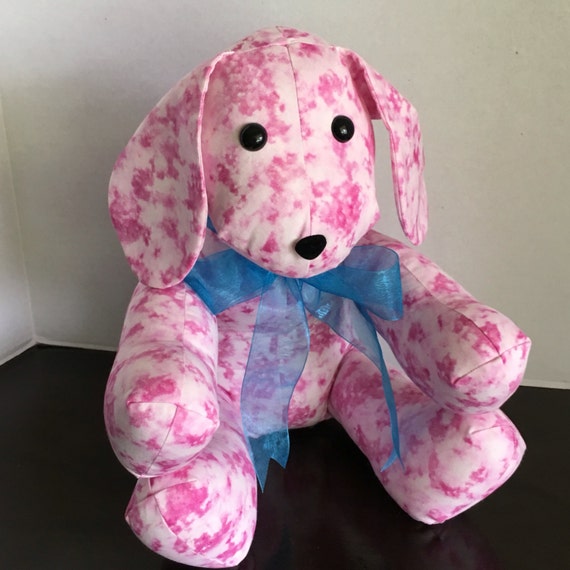 pink and white stuffed dog