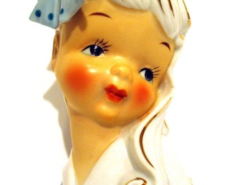 Young girl Head Vase. Hand painted. Dressed in Blue with Large Blue Polk-a-Dot Bow. Stamped N506D. Product No. 254051