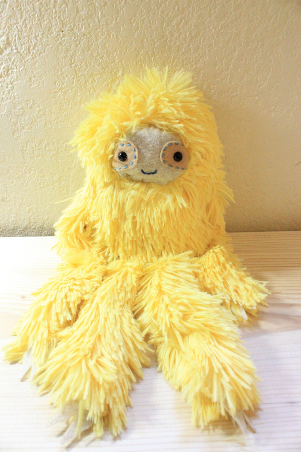 yellow sloth stuffed animal