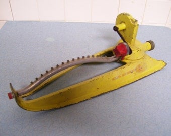 Vintage Yellow Nelson Capri Oscillating Sprinkler.