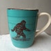 Sasquatch Turquoise Blue and Cream Colored Ceramic Coffee Cup