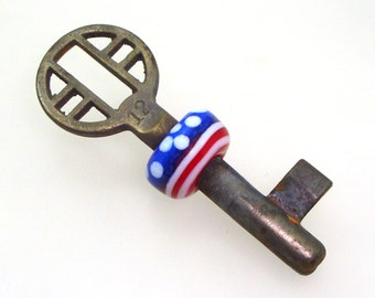 Handmade Lampwork Glass Bead - Beaded skeleton key. Red, white & blue, lines, dots. Patriotic, Fourth of July, Independence Day, Americana.