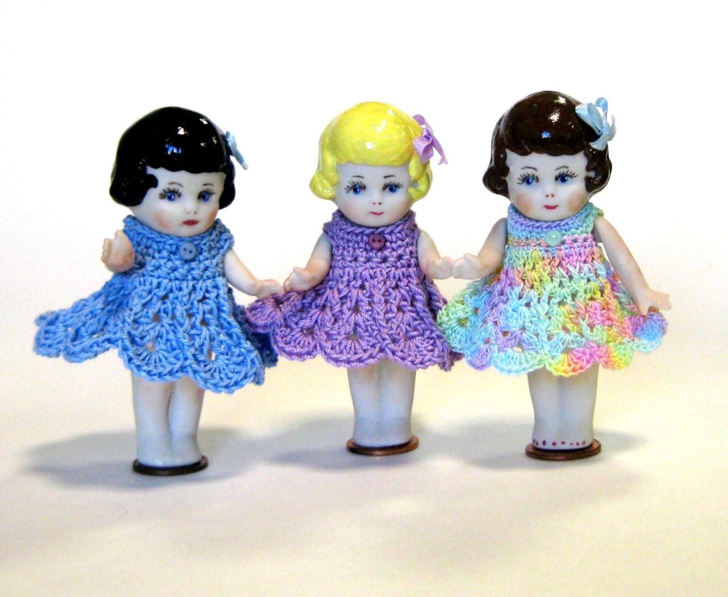 Frozen Charlottes 3 doll cast in porcelain from a